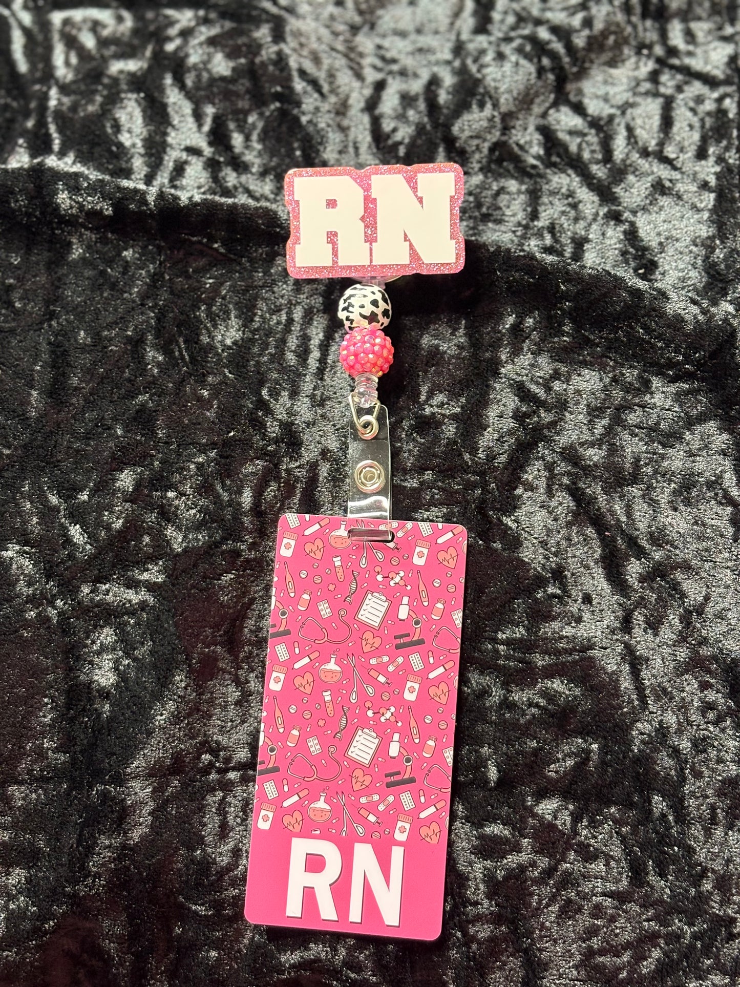 Pink Badge Reel with ID card.