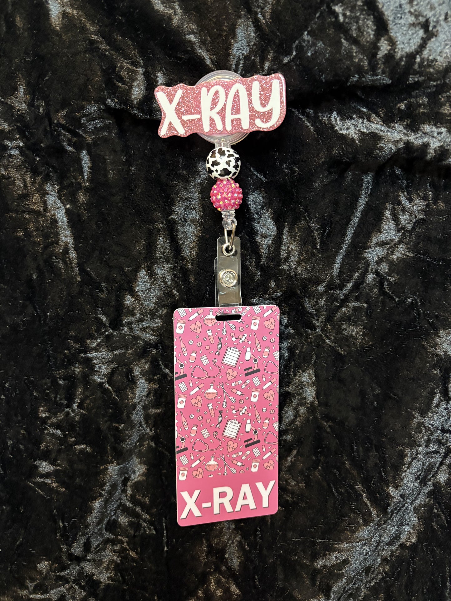 Pink Badge Reel with ID card.