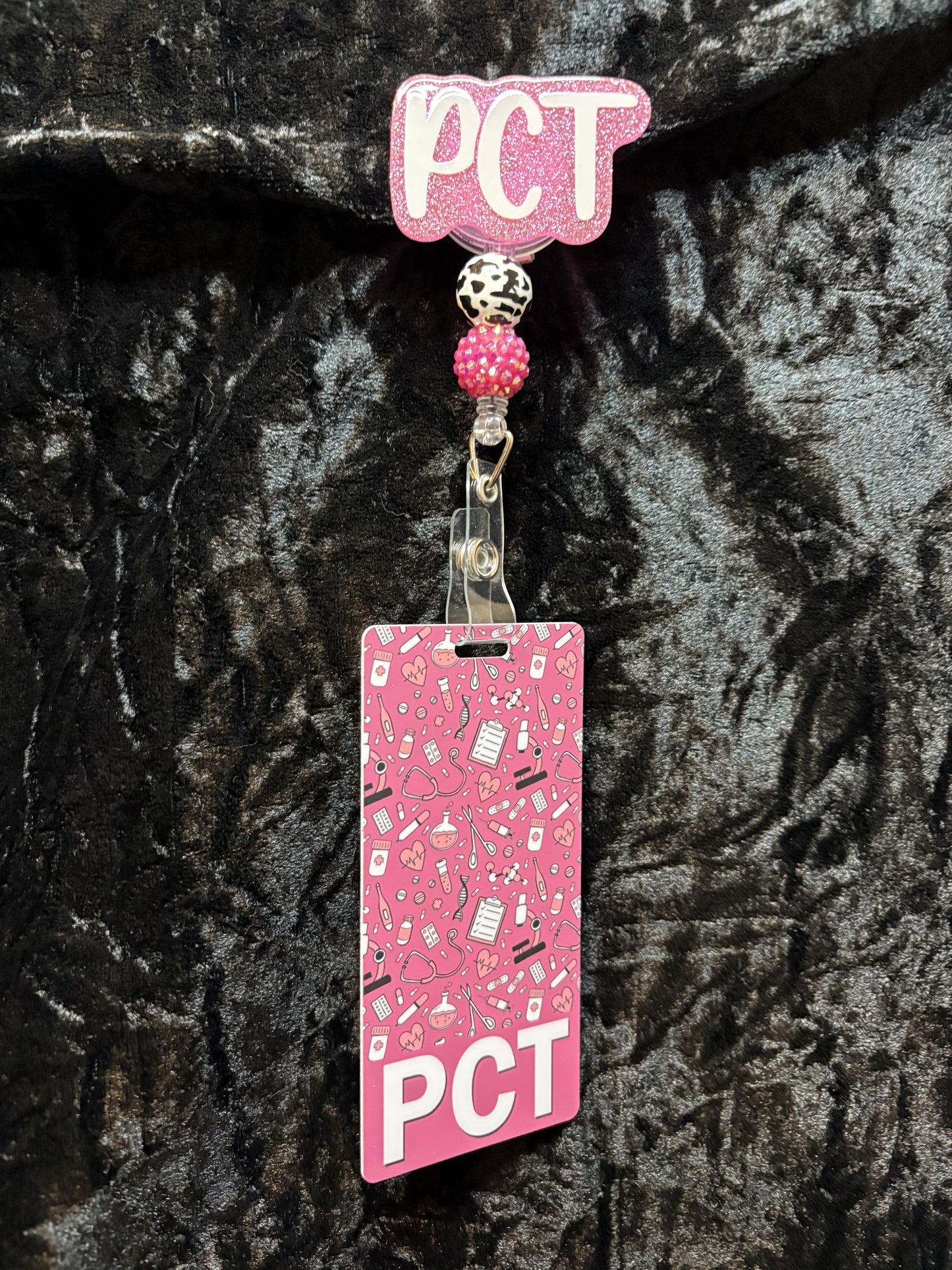 Pink Badge Reel with ID card.