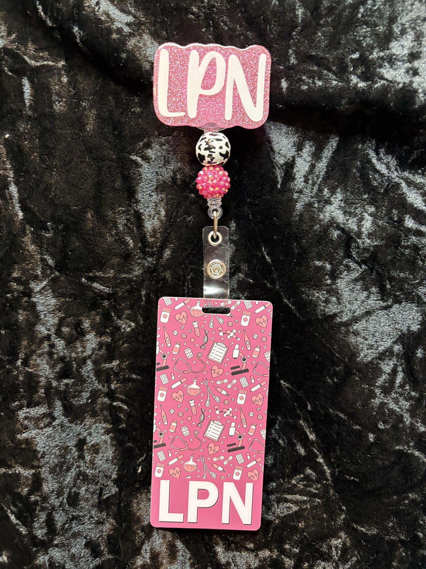 Pink Badge Reel with ID card.