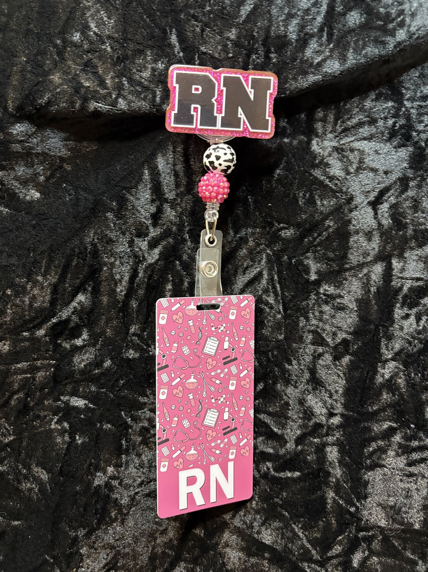 Pink Badge Reel with ID card.